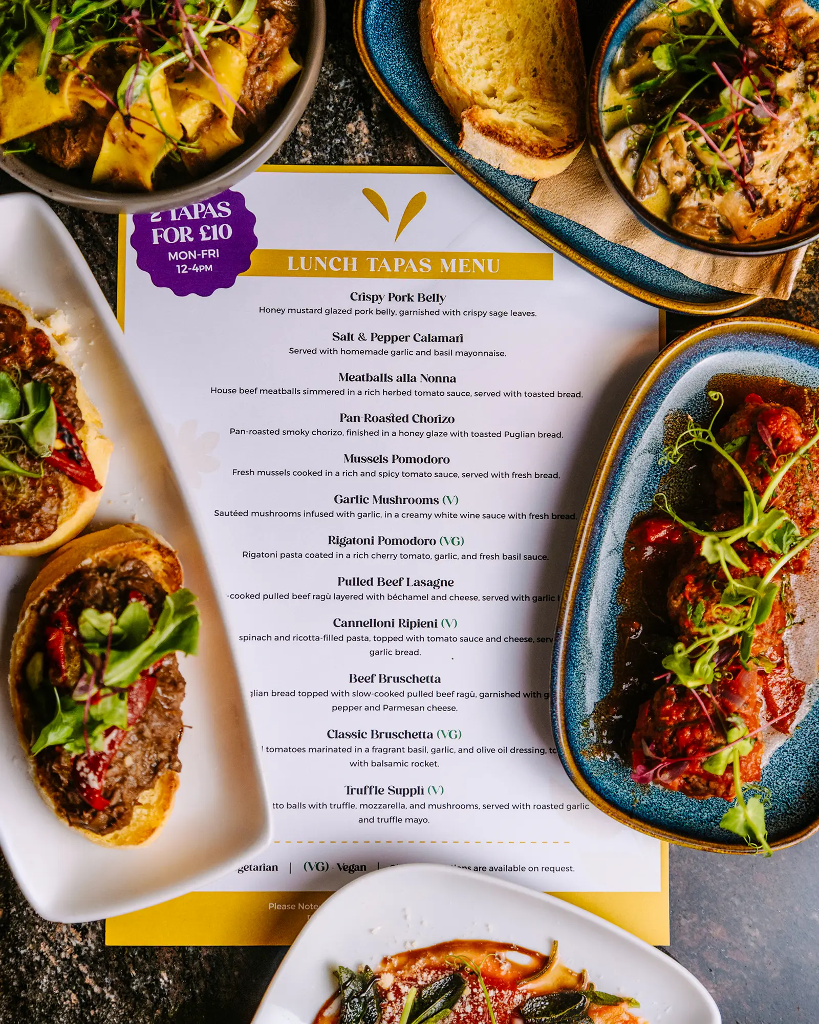 cicchetti-lounge-york-lunch-tapas-menu Lunch tapas menu surrounded by Italian small plates, pasta, mushrooms and toasted bread at Cicchetti Lounge in York.